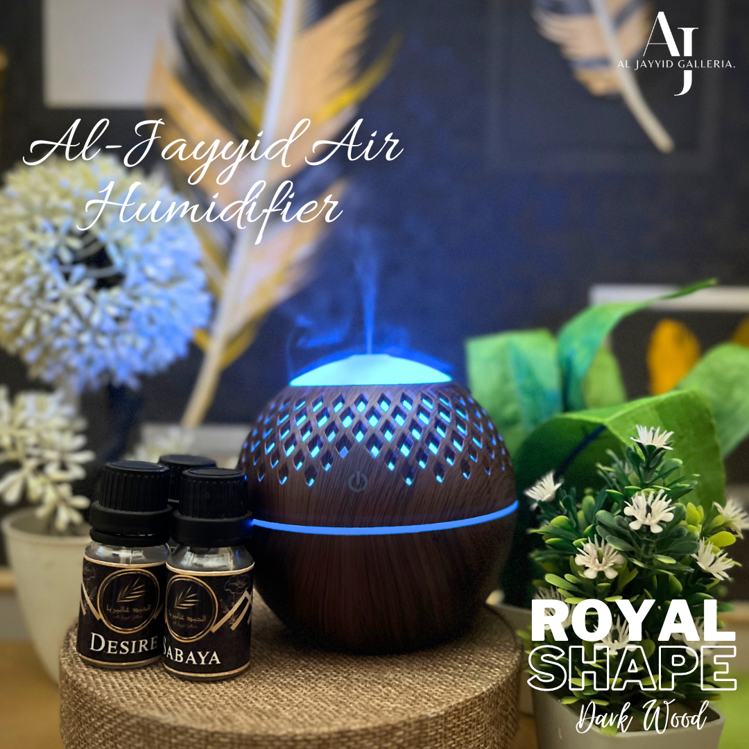 Al Jayyid Air Humidifier royal shape in a light wood colour with 3 fragrance bottles Oud, Sabaya & Desire. 